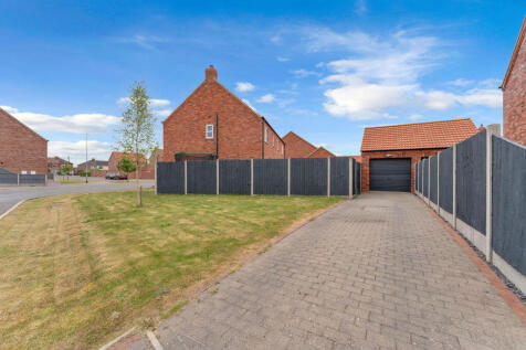Side, driveway and garage