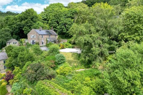 Drone shot - front of home, driveway and front gar