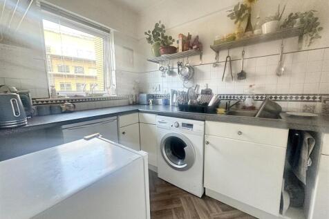 Bright kitchen with ample workspace and storage...