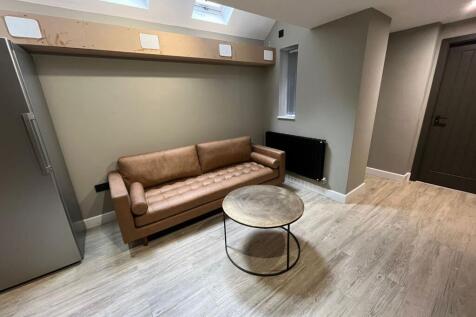 Contemporary ground-floor living area with a le...