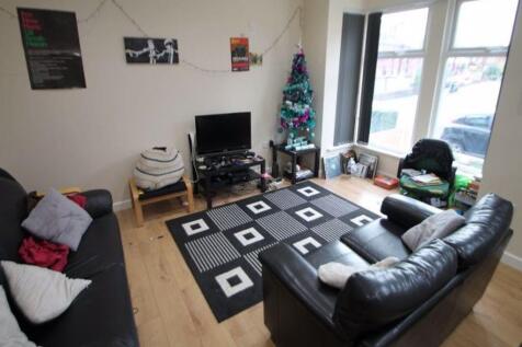 A cozy and inviting living room featuring comfo...