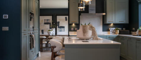 The Richmond interior kitchen area with island unit and view of the dining room in the background