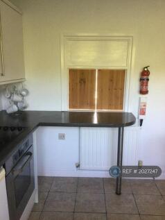 Kitchen With Breakfast Bar And Serving Hatch