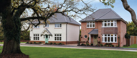 Two modern detached houses with landscaped gardens, one with a white exterior and the other with red
