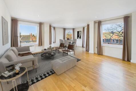 Open plan living area with balcony (digitally stag