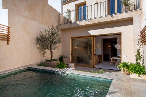 Mediterranean patio with pool and dining area ¿ a private garden oasis