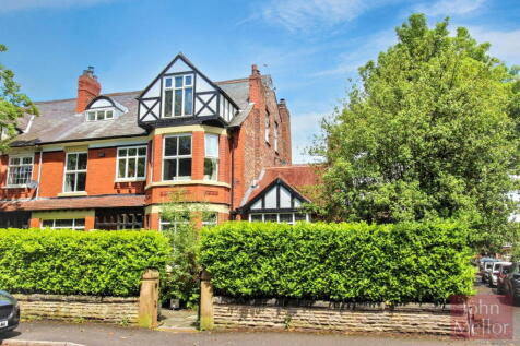 A stunning and most imposing semi detached family home standing on a very generous corner plot with extended accommodation, delightful garden areas and parking to the rear accessed via an electric gat