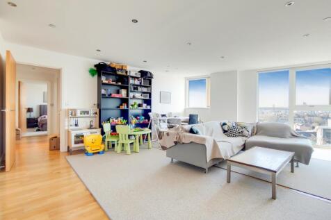 Part-furnished, two-bedroom apartment offering sweeping views across the Thames and London's iconic landmarks through floor-to-ceiling windows. This light-filled riverside residence features modern li