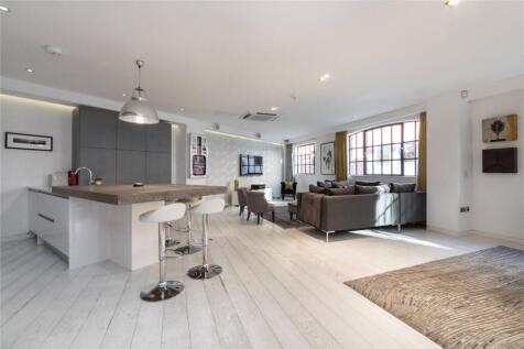 An impressive loft style two-bedroom apartment within a warehouse conversion on Kean Street in Covent Garden. With generous ceiling heights and a large open plan reception area, the space is perfect f