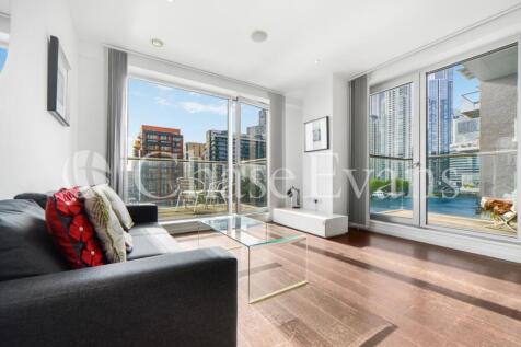 A superb three bedroom, two bathroom, dock-facing apartment with balcony set within Baltimore Wharf, located next to Crossharbour DLR station, Canary Wharf E14. This modern apartment includes an invit