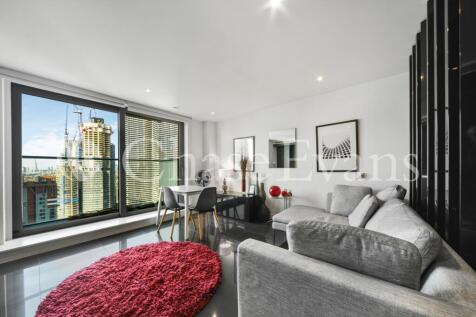 A modern studio with a balcony in Pan Peninsula, the iconic residential development in Canary Wharf. This property boasts full height windows and benefits from comfort cooling, private balcony, fully