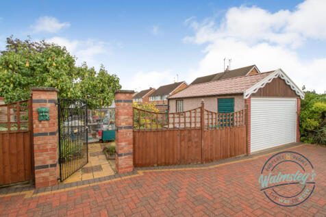 Garage &amp; gated entrance to gardens