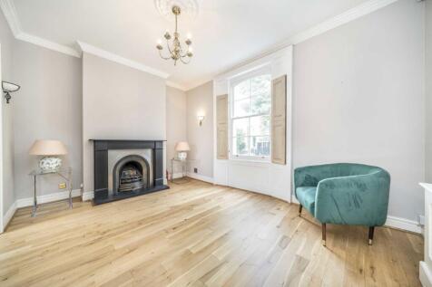 A beautifully presented three bedroom end of terrace house split over four levels. On the ground floor you are greeted with a bright double reception room with large windows and fireplace making it th