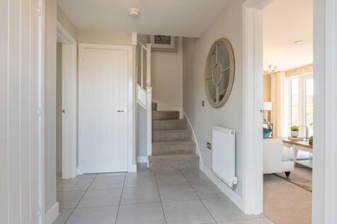 Central hallway with under stairs storage cupboard