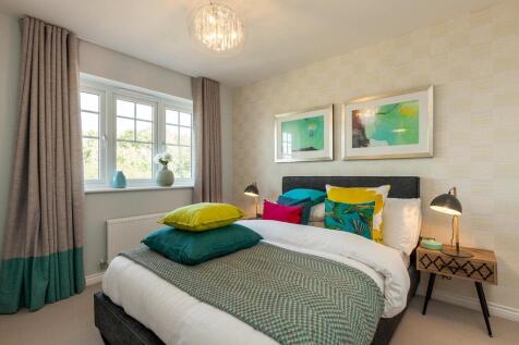 The main bedroom looks out to the rear garden