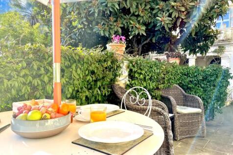 A cozy outdoor dining setup with a table under an