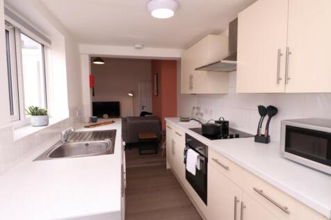 A bright and modern kitchenette featuring sleek...