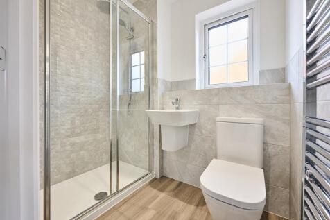 With upgraded tiling and towel rails included