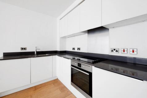 Contemporary two-bedroom, two-bath flat with open-plan living, private balcony, high-spec kitchen, en-suite, ample storage, and great city views. Close to amenities and transport links.