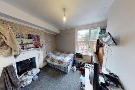 Cozy bedroom with natural light coming through ...