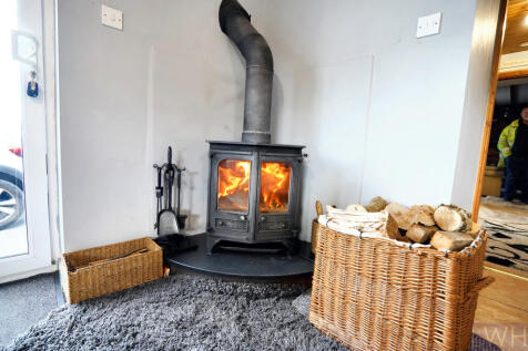 Log Burner in Kitchen