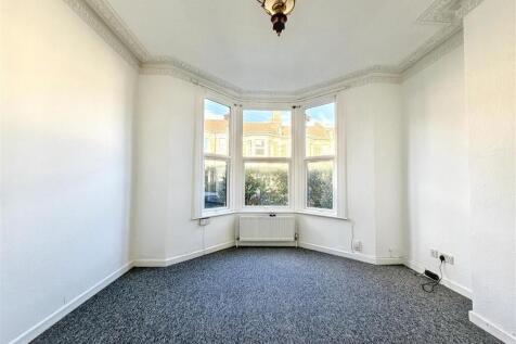 Bright room with large sunny bay window...