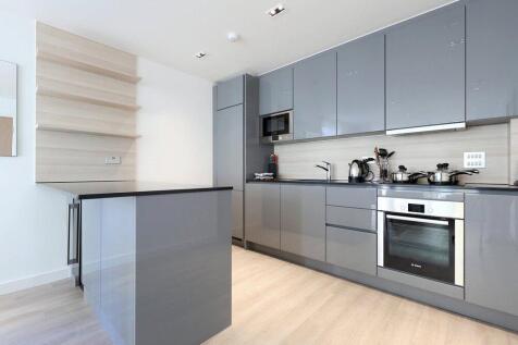A contemporary two-bedroom apartment within a sought-after Woodberry Down development, offering 921 sq ft of modern living space with premium resident amenities including 24-hour concierge, gym, and s