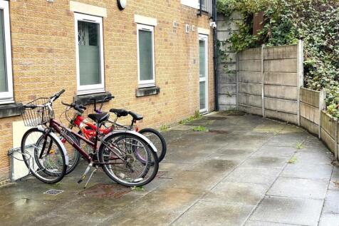 Private paved courtyard area with bike parking ...
