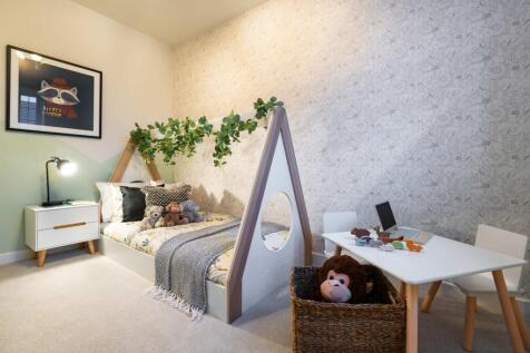 A child's bedroom features a teepee-style bed with stuffed animals in the foreground and a desk with