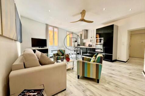 Spacious living room with modern decor, large wind