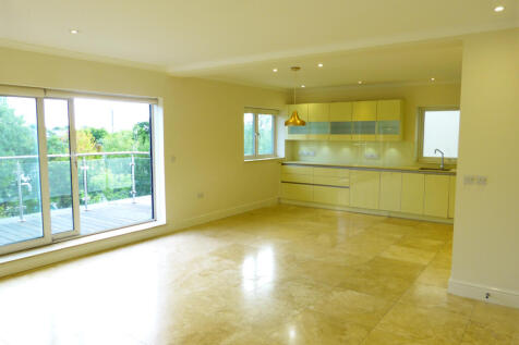 A spacious three-bedroom flat located in The Vale, London, offering a modern open-plan lounge, fully equipped kitchen, and two bathrooms. The property features a balcony, off-road parking, and access