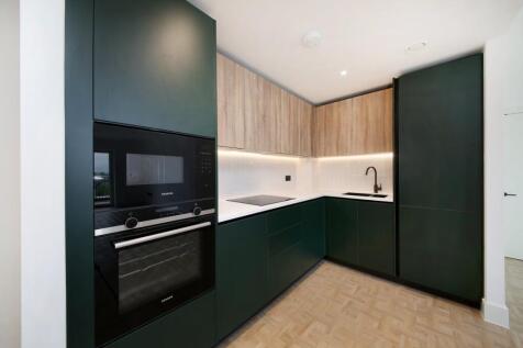 A stylish two-bedroom apartment in Provence Apartments at One Clapham Junction. It features floor-to-ceiling windows, a high-spec kitchen, two double bedrooms, en-suite, an elegant family bathroom, an