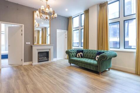 This stunning apartment at 'The Lightwell' features two spacious bedrooms with two bathrooms and a large open-plan living area fitted with large windows and high ceilings to make this city-centre apar