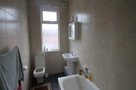 A clean and functional bathroom featuring a bat...