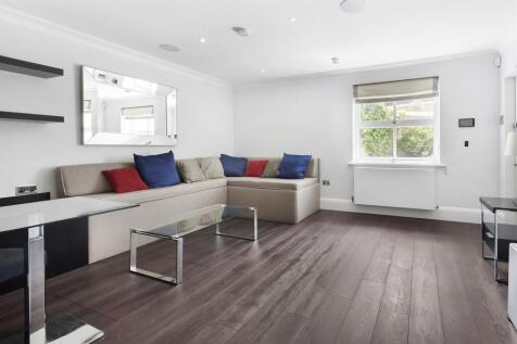 Studio flat in Chelsea, with a pull-down bed and separate bathroom and kitchen. Available now on an unfurnished basis (with a built-in bed and sofa.)