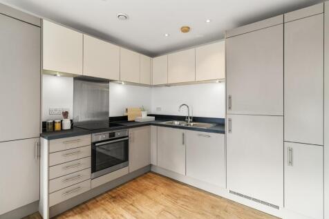 Experience culinary delight in this sleek and modern kitchen, designed for both style and functionality.