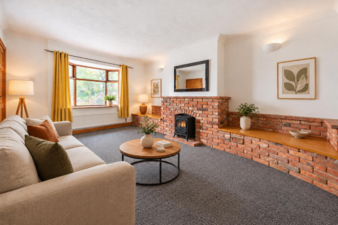 Minimalist Living Room with Brick Fireplace.png