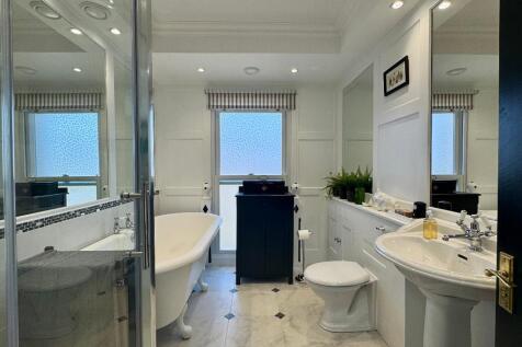 Family bathroom with shower and bath