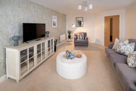 a living room with a white table and a white coffee table