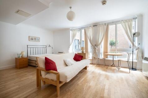 A large studio apartment with separate kitchen, storage and patio, situated in this portered development in the heart of the City. Parking available by separate negotiation.