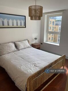 Bedroom With Queen Sized Bed And Large Wardrobe