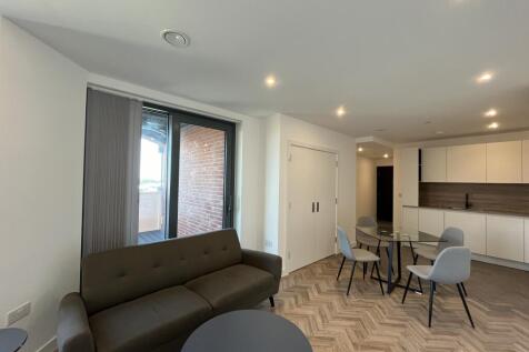 A modern one-bedroom apartment with a private balcony in the Three Waters development, offering stylish riverside living with excellent transport connections and premium resident amenities.