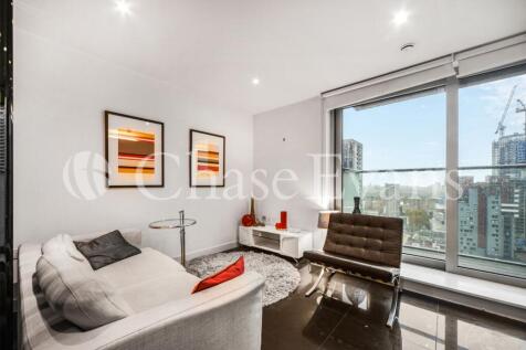 Modern studio apartment located within Pan Peninsula’s West Tower. This furnished studio apartment has an open plan living area, a modern kitchen with integrated appliances, tiled flooring, floor-to-c