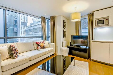 This beautiful interior designed three bedroom apartment is set within a modern block in the sought after Paddington Basin in W2. This modern apartment comprises a beautiful reception room, a modern f